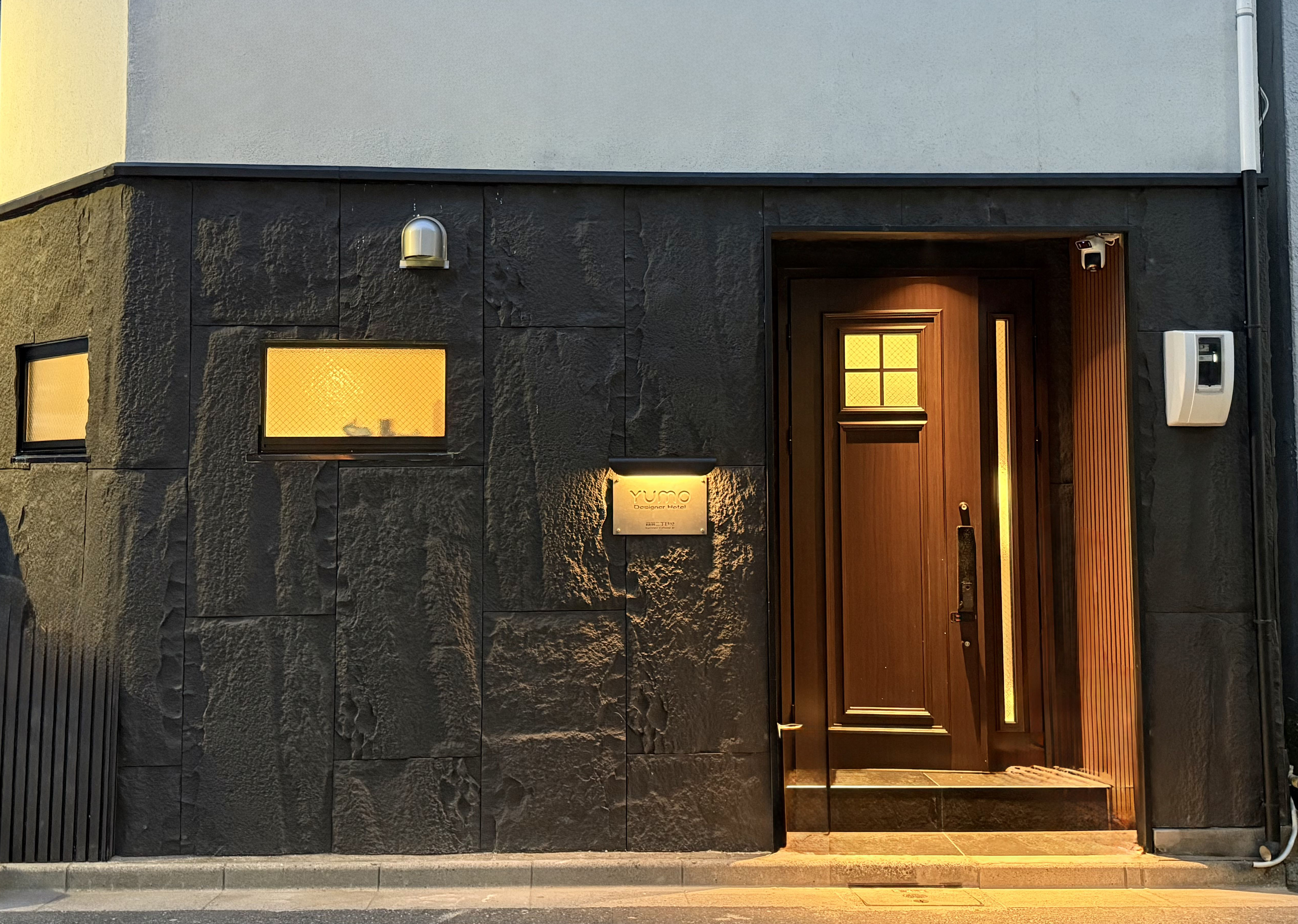 YUMO Designer Hotel entrance at night